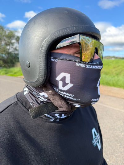 Person wearing a black helmet and face mask with visible VIEA branding outdoors.